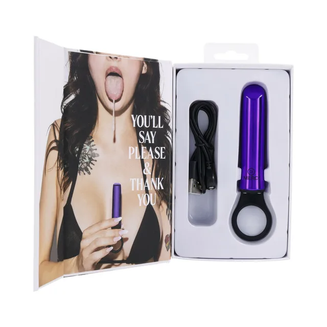 open Merci Power Play box displaying violet vibrator and magnetic USB cable