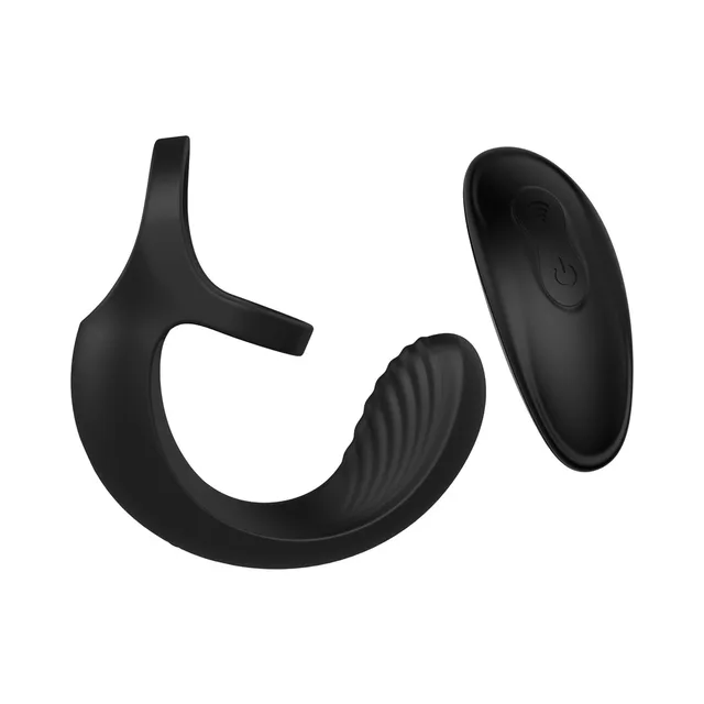 Black double-loop ball cradle beside oval remote control