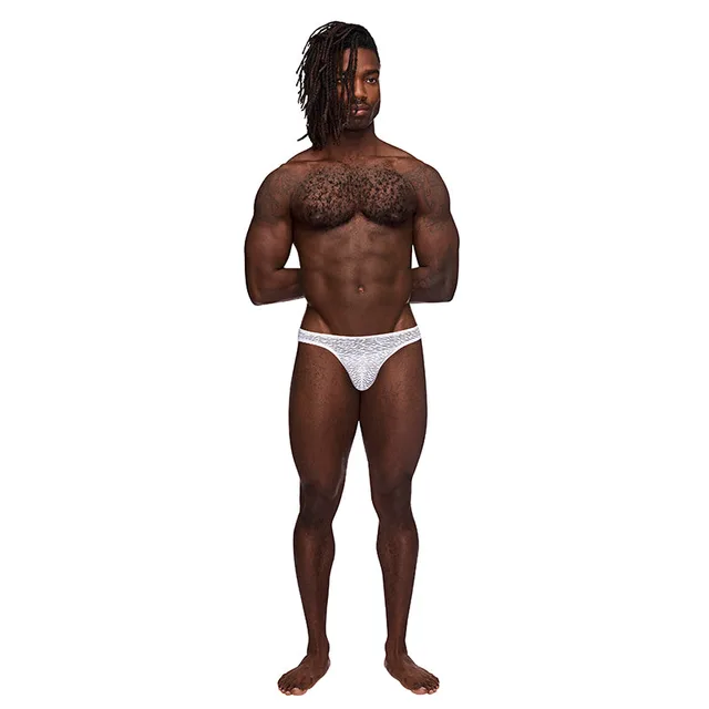 Model wearing white Male Power Sneak Peek thong with narrow sides