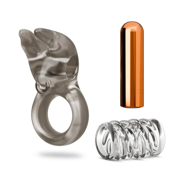 Blush Stay Hard vibrating ring set 4 components separated beside a copper-tone bullet