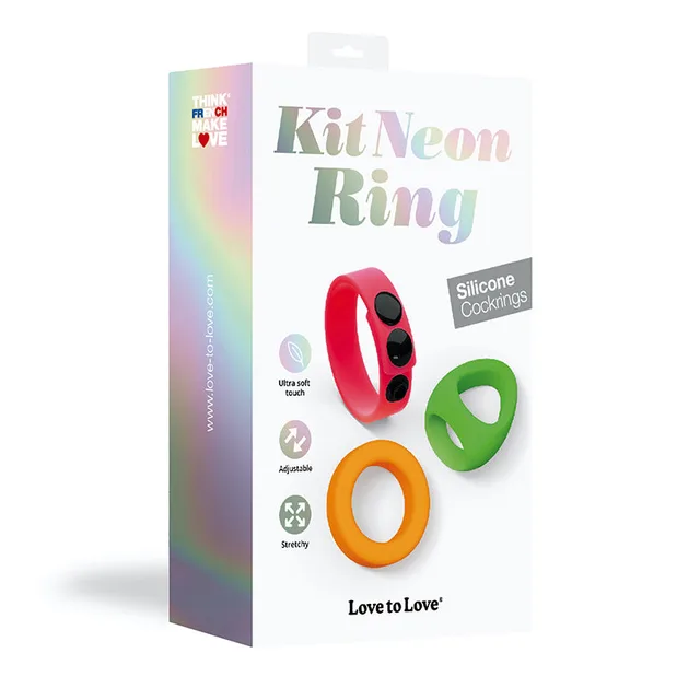 Neon Ring set with pink, green and orange silicone rings beside box