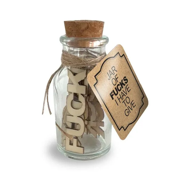 small corked glass Jar of Fucks filled with tan wooden pieces and kraft hanging tag
