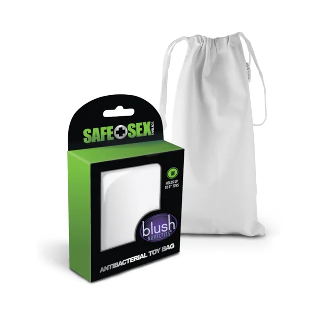 medium white Blush drawstring toy bag beside green and black package