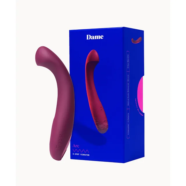 Plum Dame Arc vibrator beside blue retail box