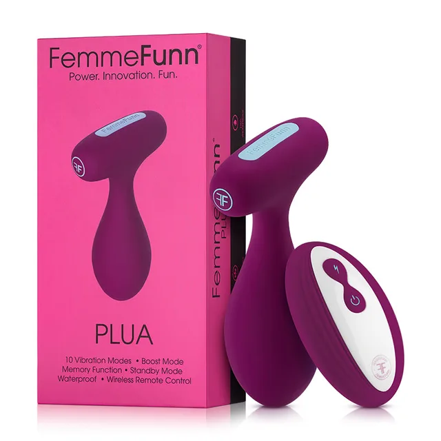 FemmeFunn Plua dark fuchsia plug and oval remote beside pink box