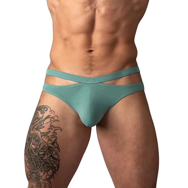 Male Power Eco Cozy Cutout Thong in green size S/M worn from the front to show the offset double waistband