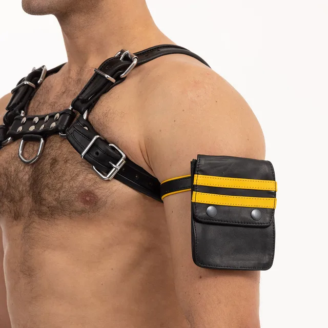 Black and yellow Prowler RED leather wallet worn closed on upper arm