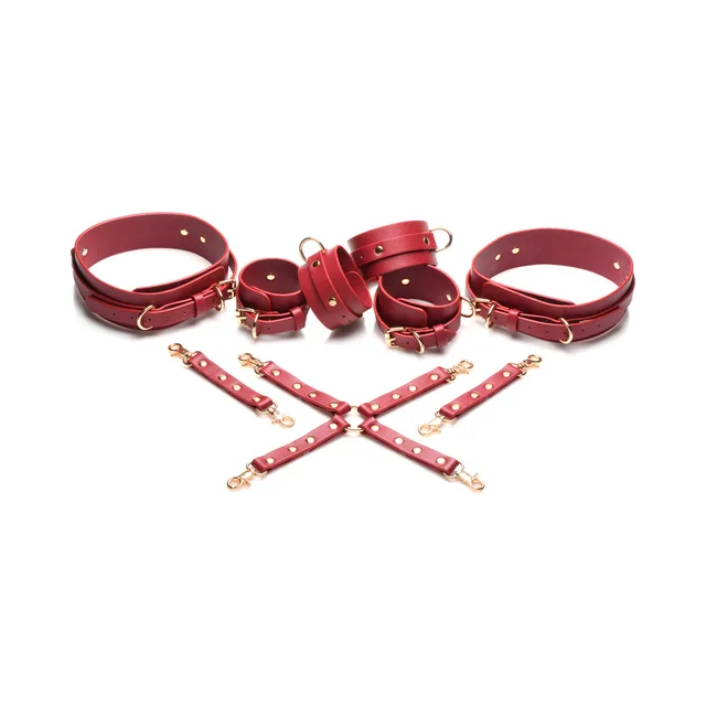 Crimson Captive red thigh wrist and ankle cuffs with crossed connectors laid out