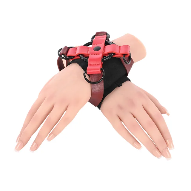 Front mannequin view of red and black Cross Cuffs joining both wrists