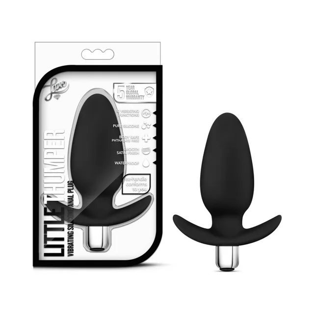 Luxe Little Thumper Black vibrating plug beside white retail package