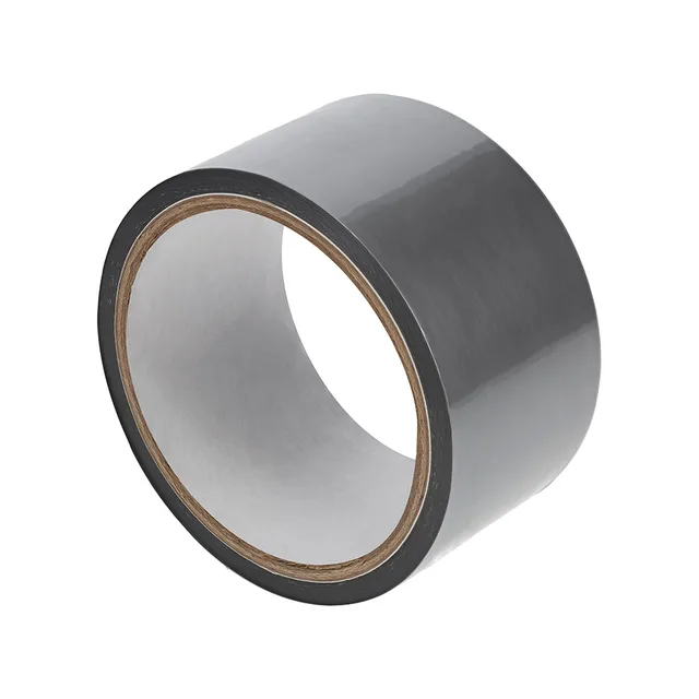 Angled view of silver-gray Ouch PVC tape roll with white core