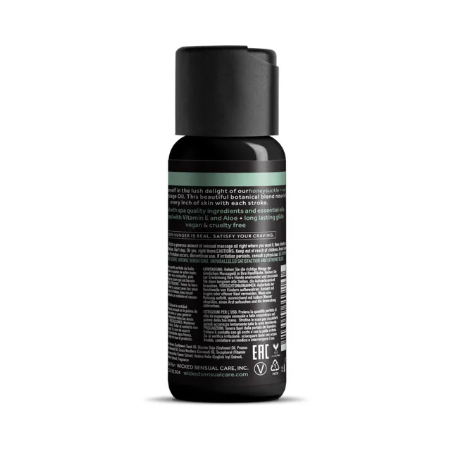 Wicked Honeysuckle and Ivy Massage Oil 4 oz black bottle rear view with dense label text