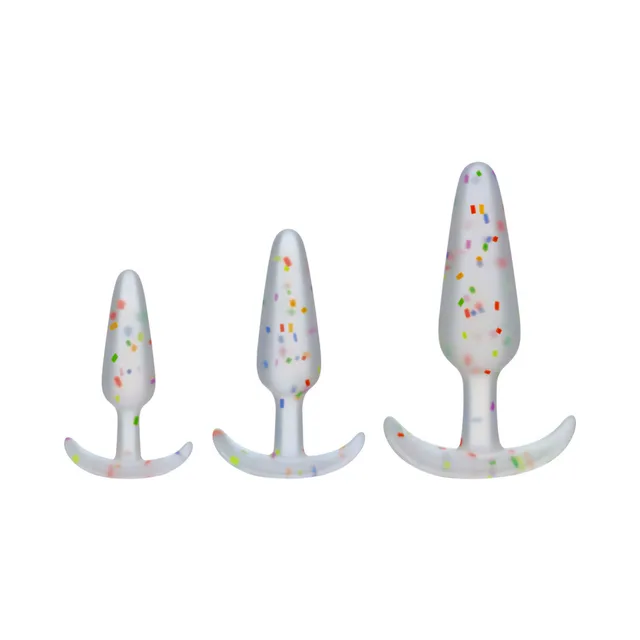 Three clear confetti plugs in graduated sizes with flared bases