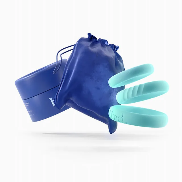 Biird Riin rings fanned beside blue storage container and pouch