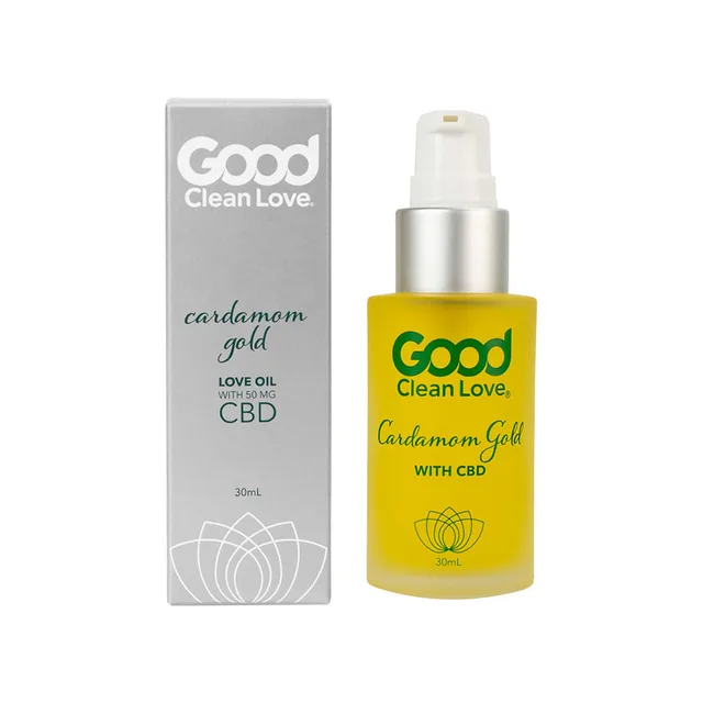 Good Clean Love Cardamom Gold yellow pump bottle beside silver carton