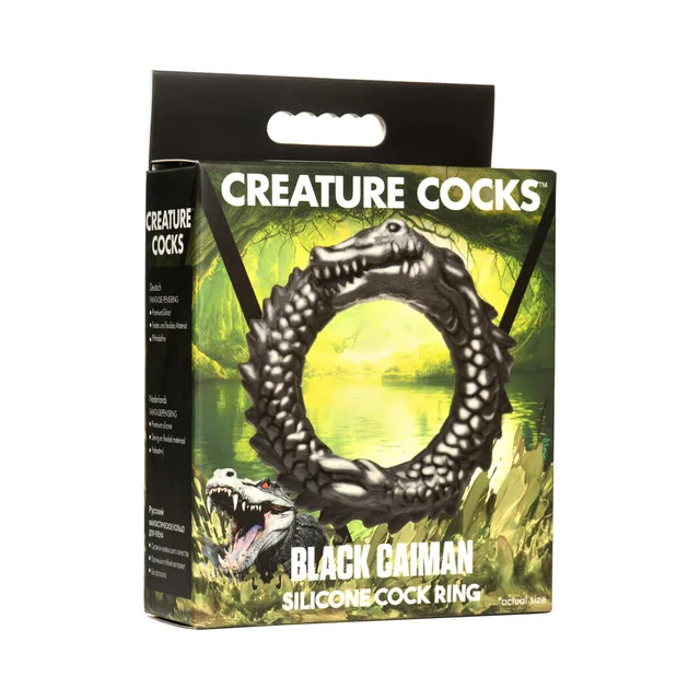 black Caiman reptile silicone cock ring with scaled circular body on box