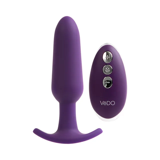 Purple tapered Bump Plus vibrator beside oval remote
