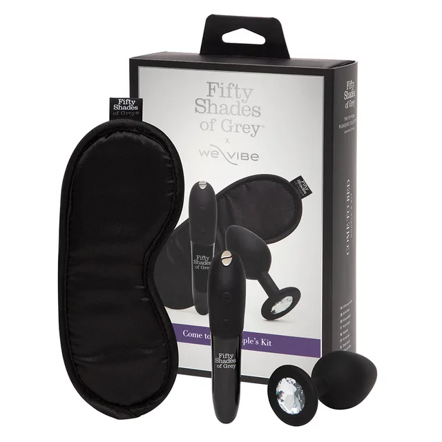 Fifty Shades We-Vibe Come to Bed black two-toy kit beside retail box with Tango X bullet and crystal plug