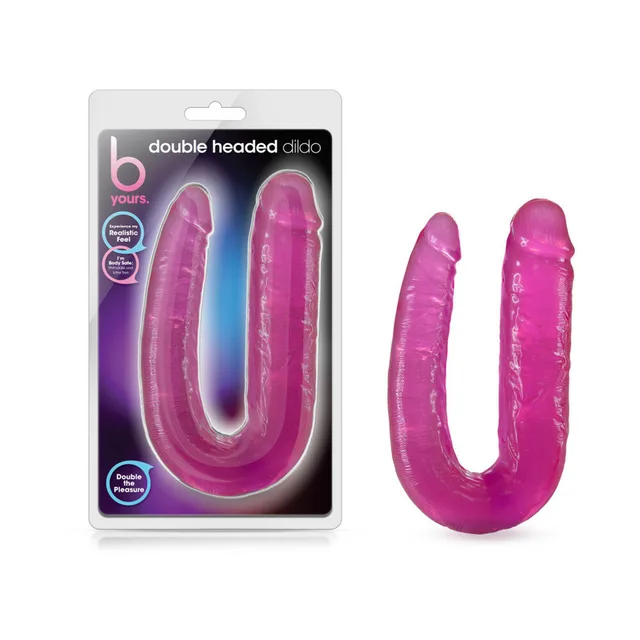 B Yours pink double-ended dildo beside blister package