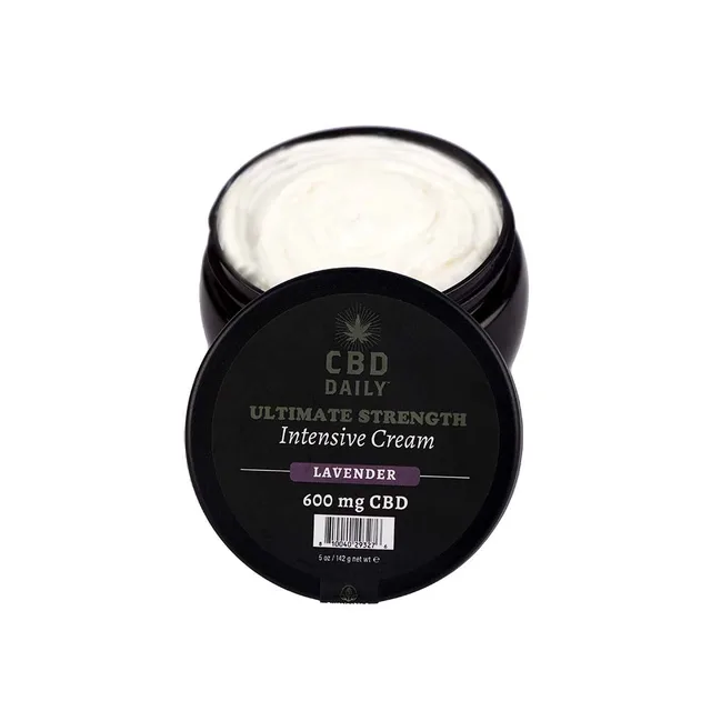 Open black CBD Daily Lavender jar showing white cream and lid