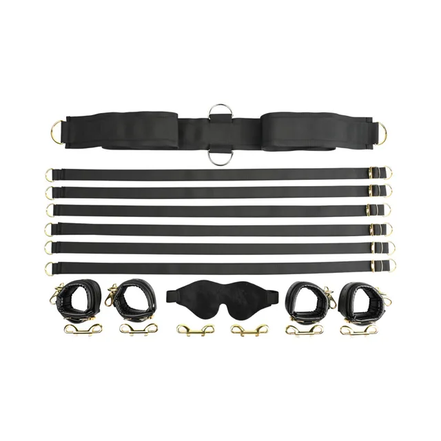 Flat lay of six black bed straps, four cuffs and blindfold