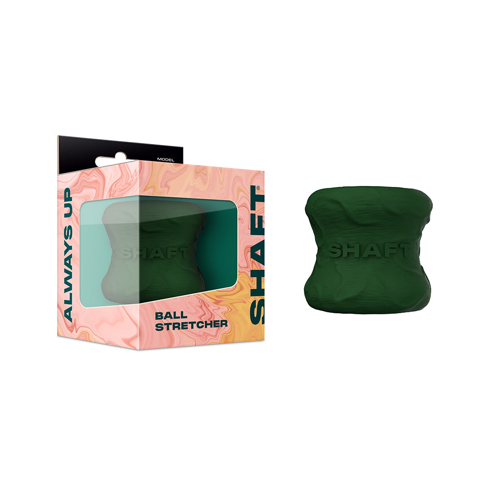 Shaft Model H: Ballstretcher Green green Shaft Model H hourglass-shaped ball stretcher beside windowed box