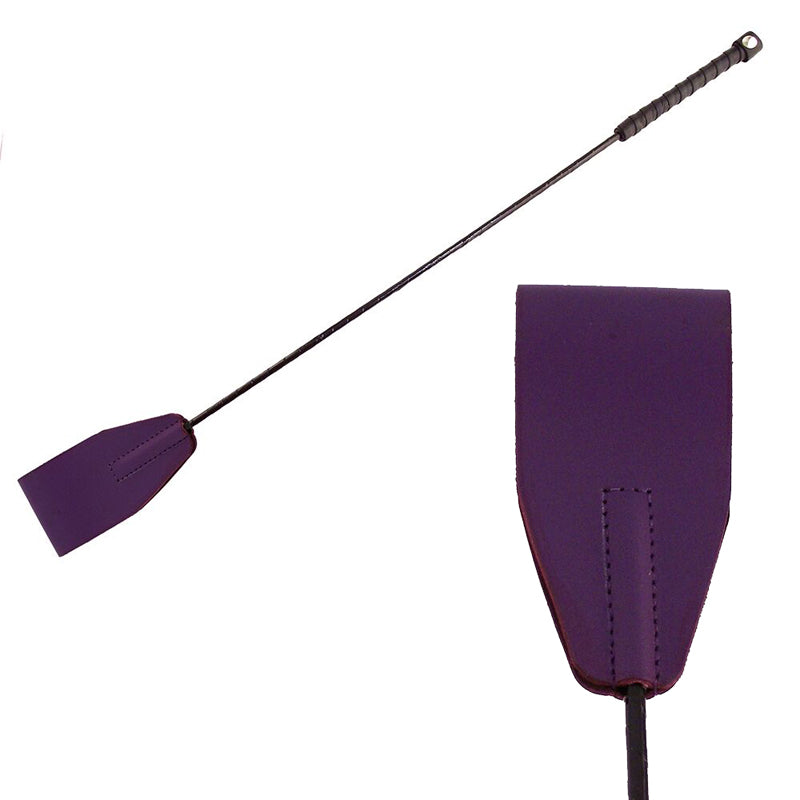 Rouge Riding Crop Purple Rouge Purple Leather Riding Crop full black shaft beside close-up of stitched purple paddle