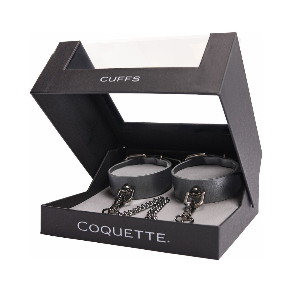 Coquette Pleasure Cuffs Grey Pair of gray Coquette cuffs with chain inside black display box