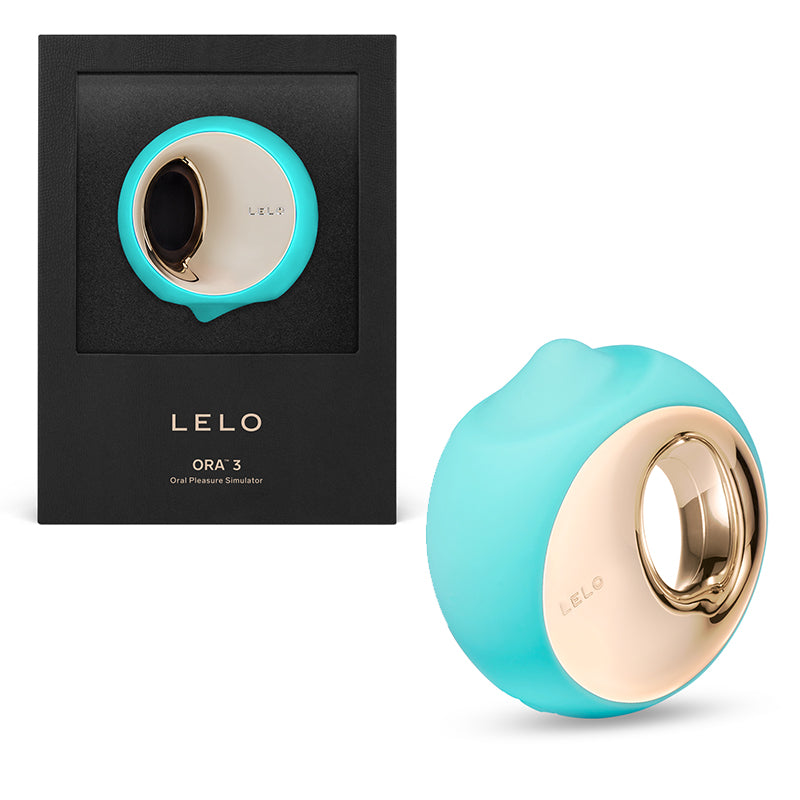 LELO ORA 3 Rechargeable Clitoral Stimulator Aqua Aqua LELO ORA 3 with gold face beside black presentation box