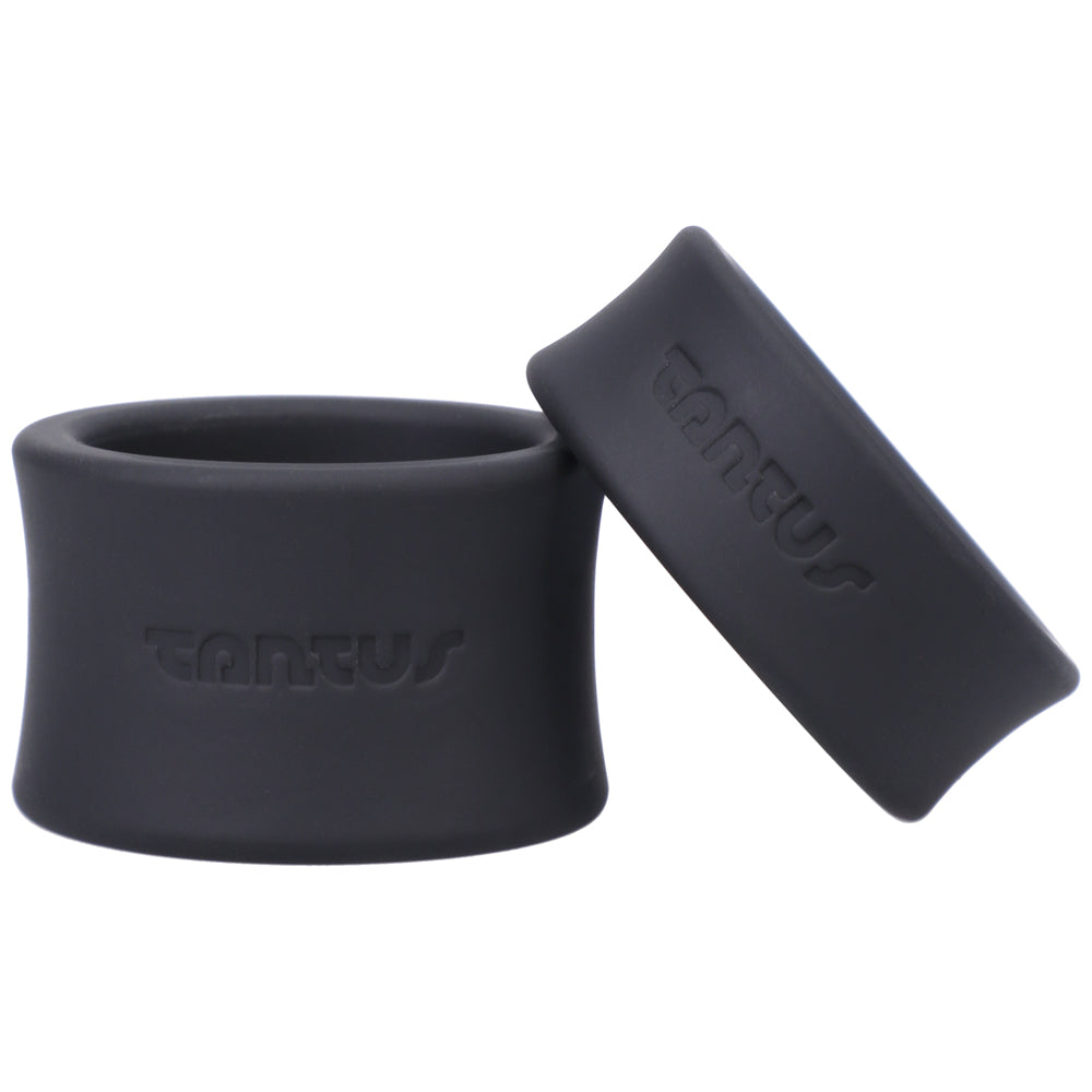 Tantus Ball Stretcher Kit Onyx Two black Tantus ball stretcher bands posed upright and angled