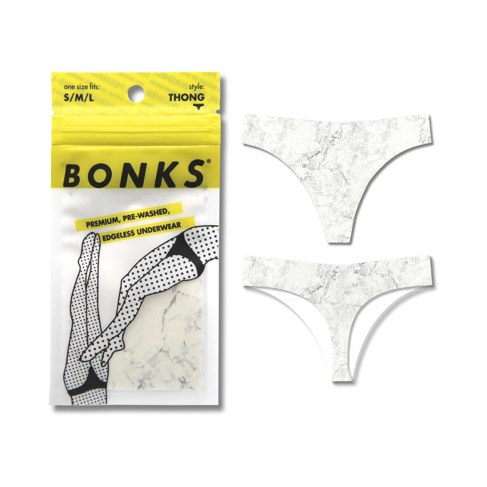 Bonks Rock Bottom Seamless Thong O/S Bonks white marble print seamless thong shown beside yellow package
