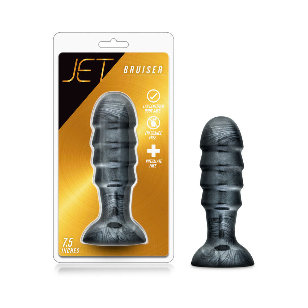 Jet Bruiser 7.5 in. Anal Plug Carbon Metallic Black Blush Jet Bruiser Carbon Metallic Black Plug beside clear retail package