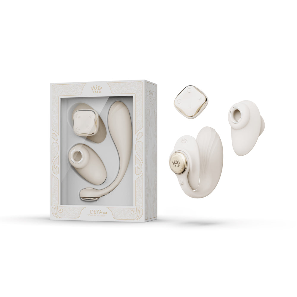 Zalo Aurora Series Deya Ivory White Zalo Aurora Deya Ivory White wearable vibrator set beside the windowed retail box with remote and body separated