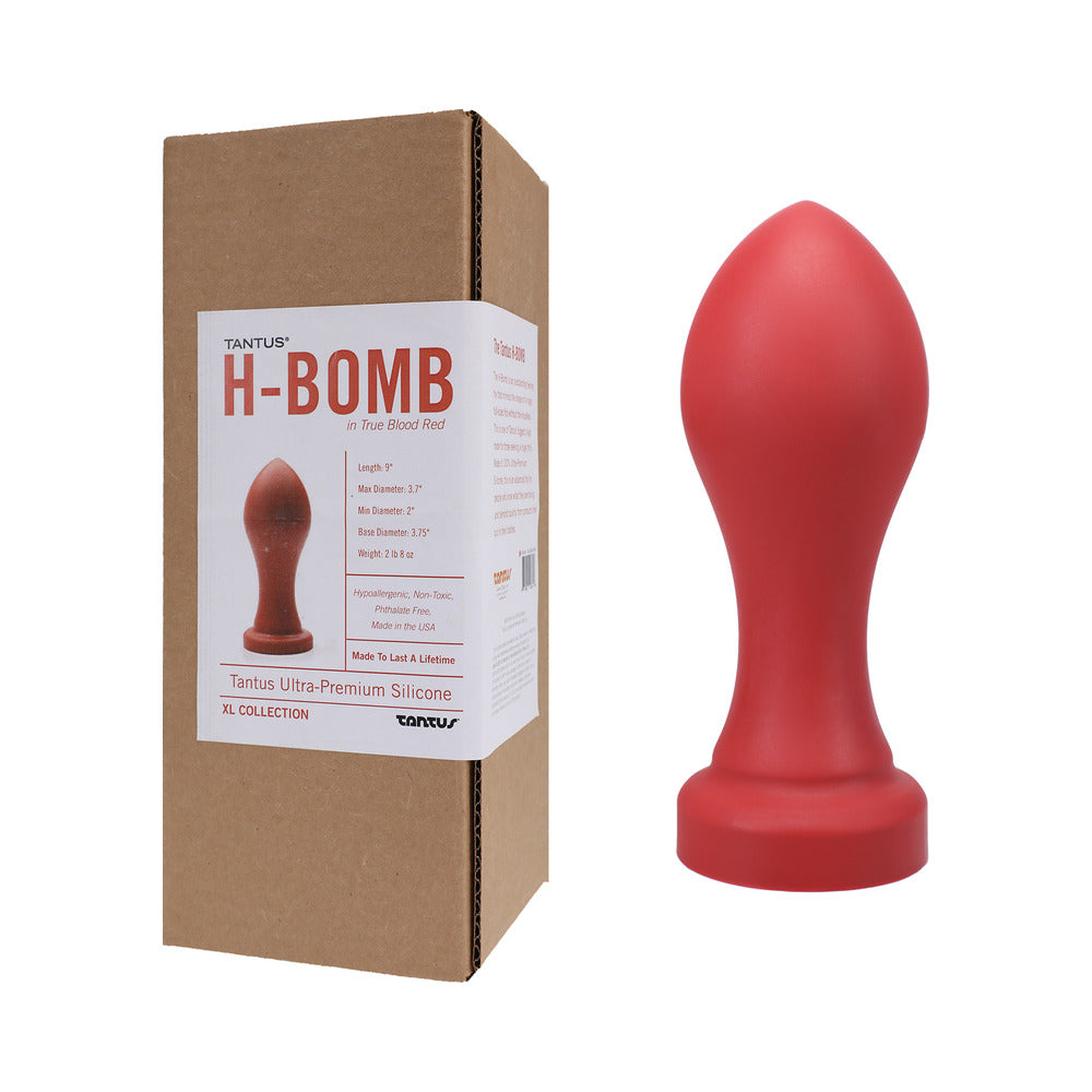 Tantus H-Bomb Dildo Ruby (Box) Red Tantus H-Bomb plug beside labeled brown retail box