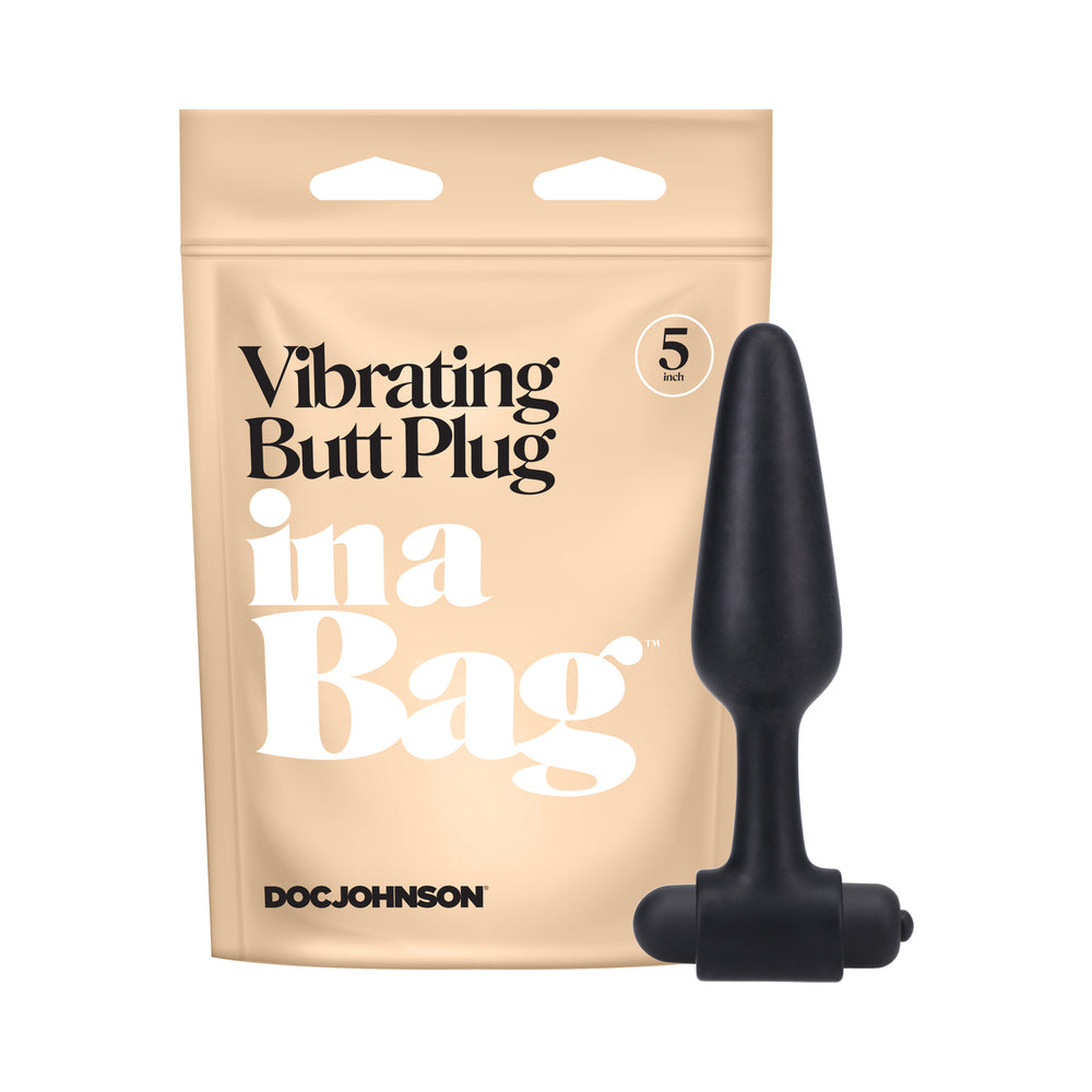 In A Bag Vibrating Butt Plug 5 in. Black black In A Bag vibrating silicone plug with wide base beside beige pouch