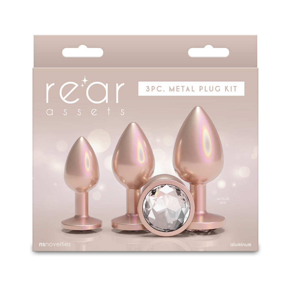 Rear Assets Trainer Plug Kit Iridescent Champagne/Clear Champagne Rear Assets three-piece aluminum plug kit with clear jewel bases