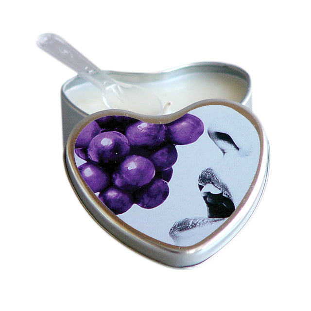 Earthly Body Hemp Seed Edible Massage Candle Grape 4 oz. Open heart-shaped silver tin of Earthly Body grape massage candle with pouring corner