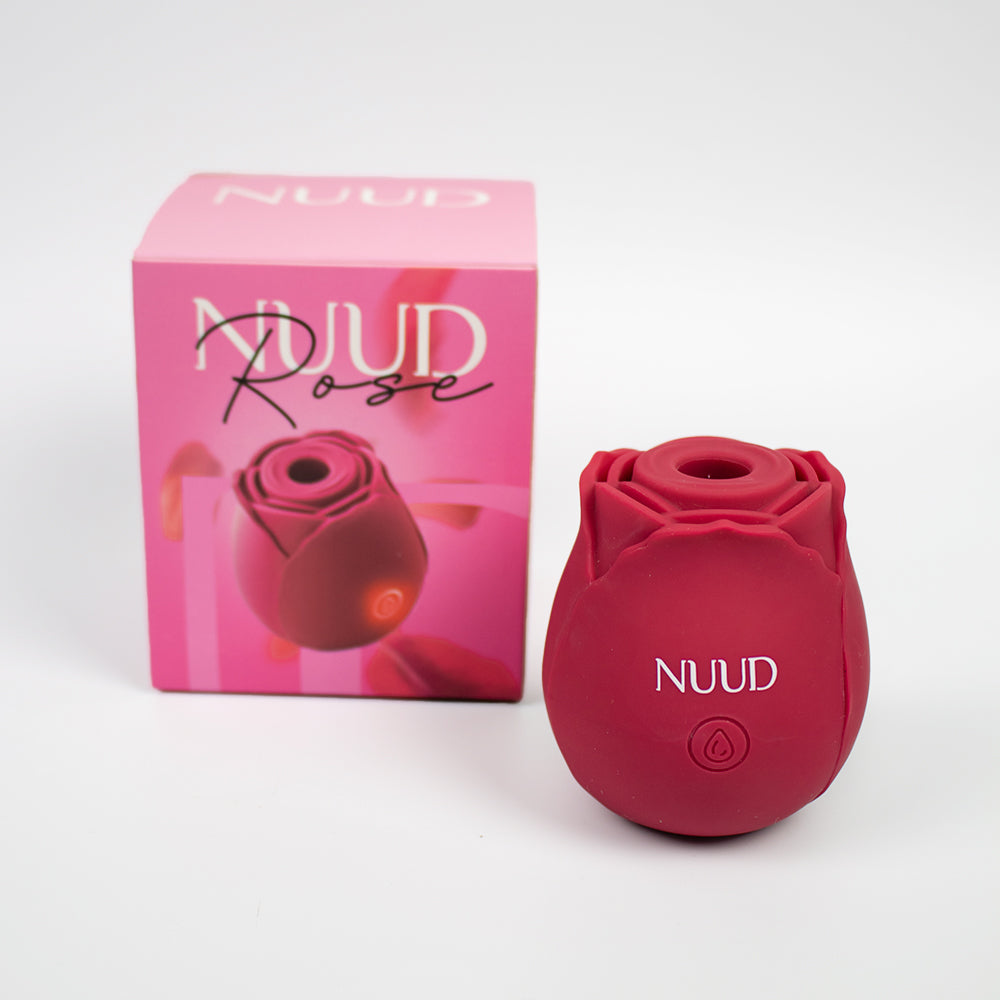 NUUD ROSE Pulsing Vibrator red NUUD Rose pulsing vibrator with open center and front button beside pink box