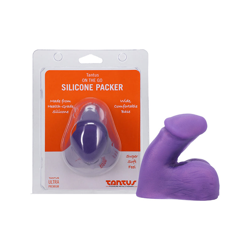 Tantus On The Go Silicone Packer Amethyst (Clamshell) amethyst-purple Tantus On The Go packer beside its clear orange-label clamshell
