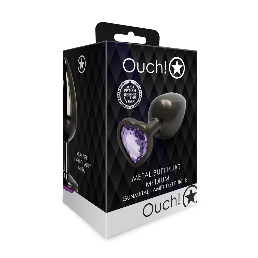 Ouch! Heart Gem Butt Plug Medium Gunmetal/Amethyst Shots Ouch medium gunmetal butt plug with amethyst heart gem angled front retail package