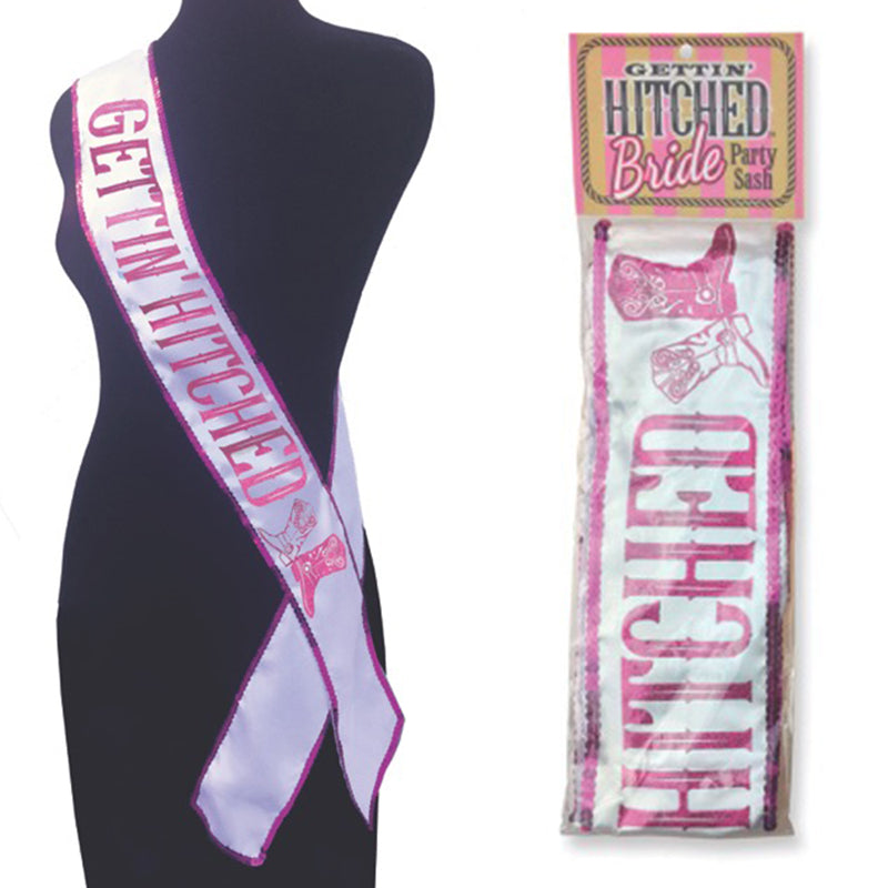 Getting Hitched Glitter Sash Little Genie Getting Hitched Glitter Sash displayed on black form beside clear hanging package