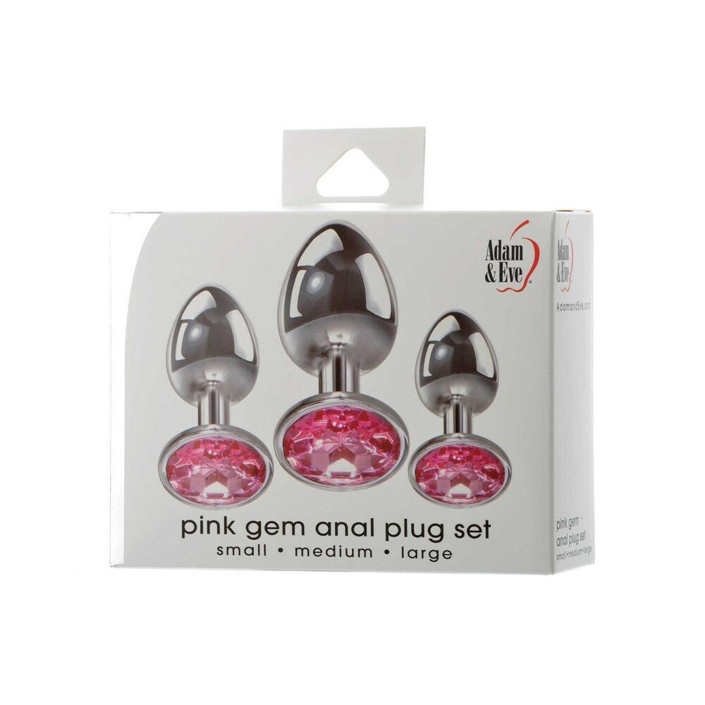 Adam & Eve Pink Gem Anal Plug Set Adam & Eve Pink Gem three-piece metal anal plug set three sizes pictured on white retail box