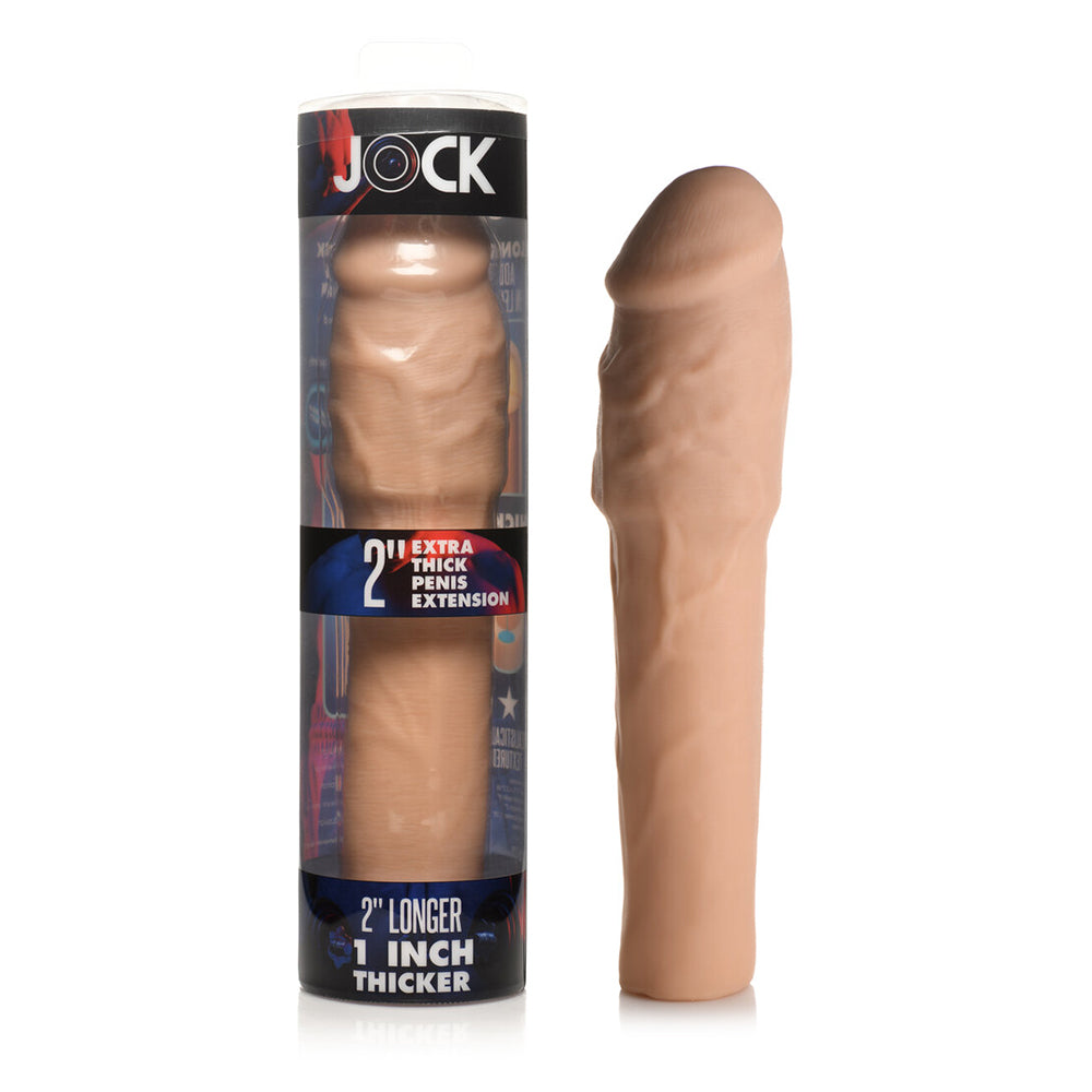 Jock Extra Thick Penis Extension Sleeve 2 in. Light light beige Jock Extra-Thick textured TPE sleeve beside retail box