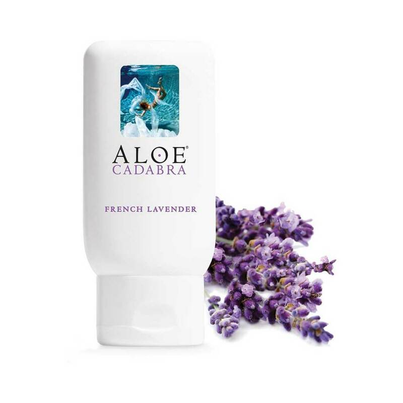 Aloe Cadabra French Lavender Aloe Lubricant 2.5 oz. white Aloe Cadabra French Lavender lubricant bottle beside purple lavender flowers