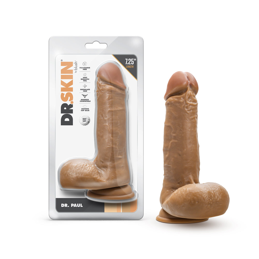 Dr. Skin Dr. Paul 7.25 in. Dildo with Balls Tan Blush Dr. Skin Dr. Paul tan 7.25-inch TPE dildo beside front retail package