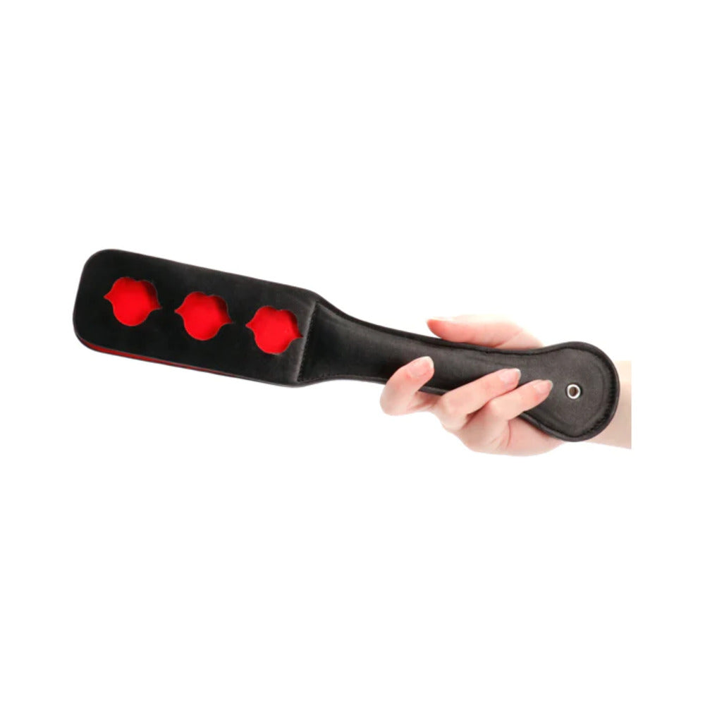 Ouch! Lip Pattern Paddle Black Black Ouch paddle with three red lip-shaped cutouts and rounded handle