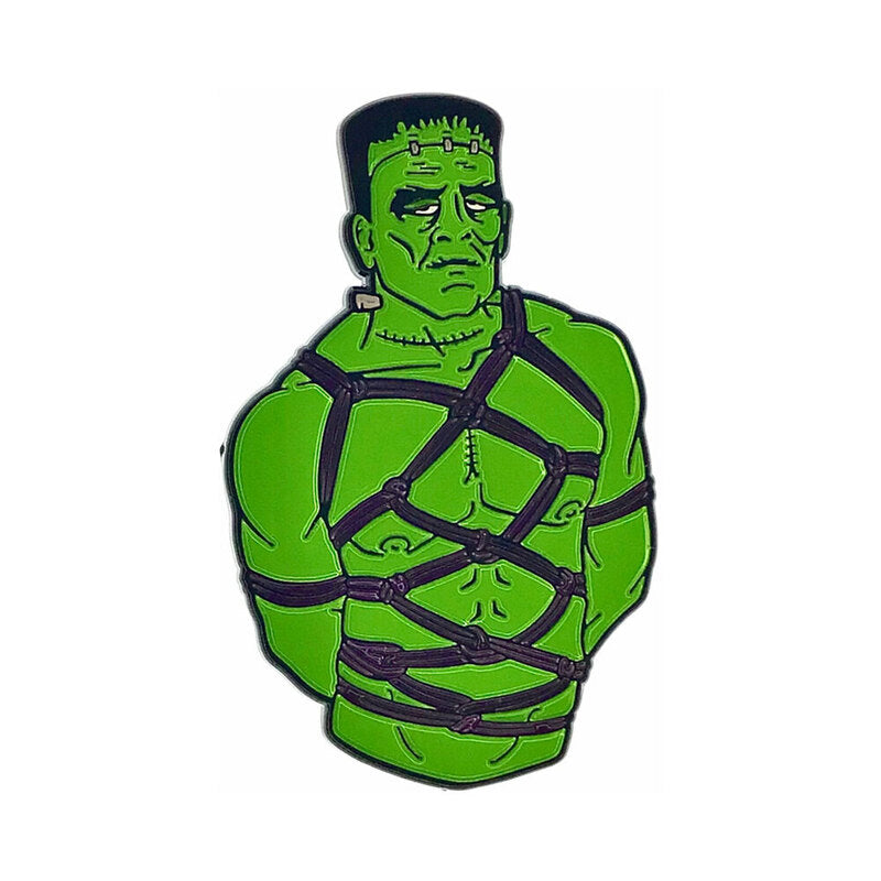 Geeky & Kinky Frank Enamel Pin green Frank character enamel pin wrapped in purple restraint straps