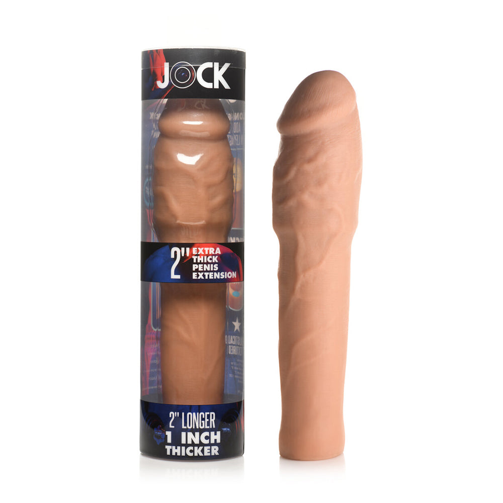 Jock Extra Thick Penis Extension Sleeve 2 in. Medium medium tan Jock Extra-Thick textured TPE sleeve beside retail box