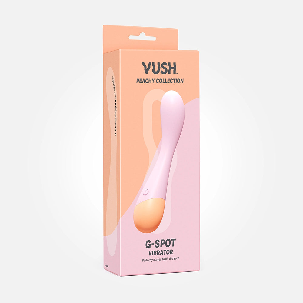 VUSH Peachy G Spot VUSH Peachy light-pink G-Spot vibrator with curved shaft on peach-colored retail box