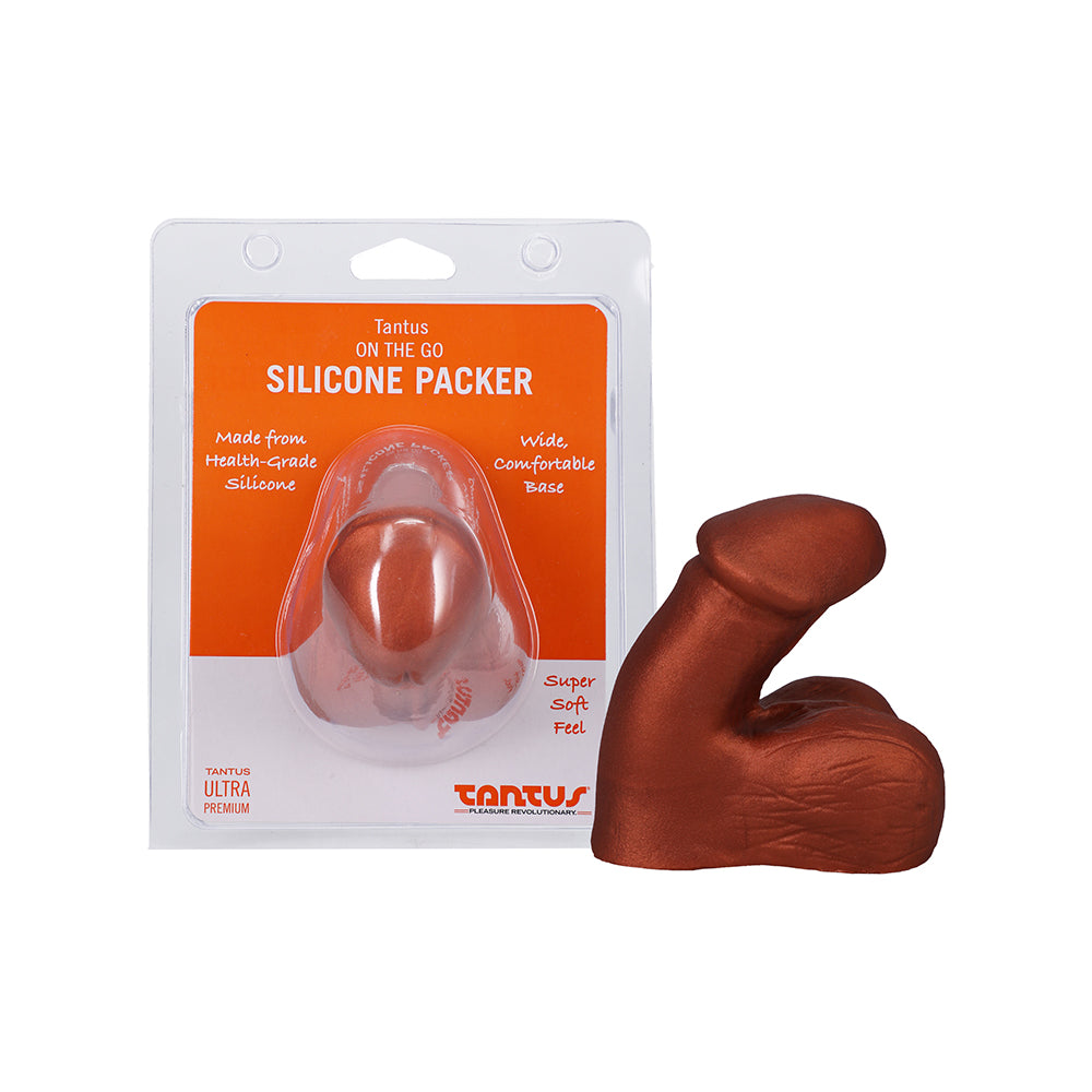 Tantus On The Go Silicone Packer Super Soft Copper Tantus On The Go copper silicone packer beside front retail package